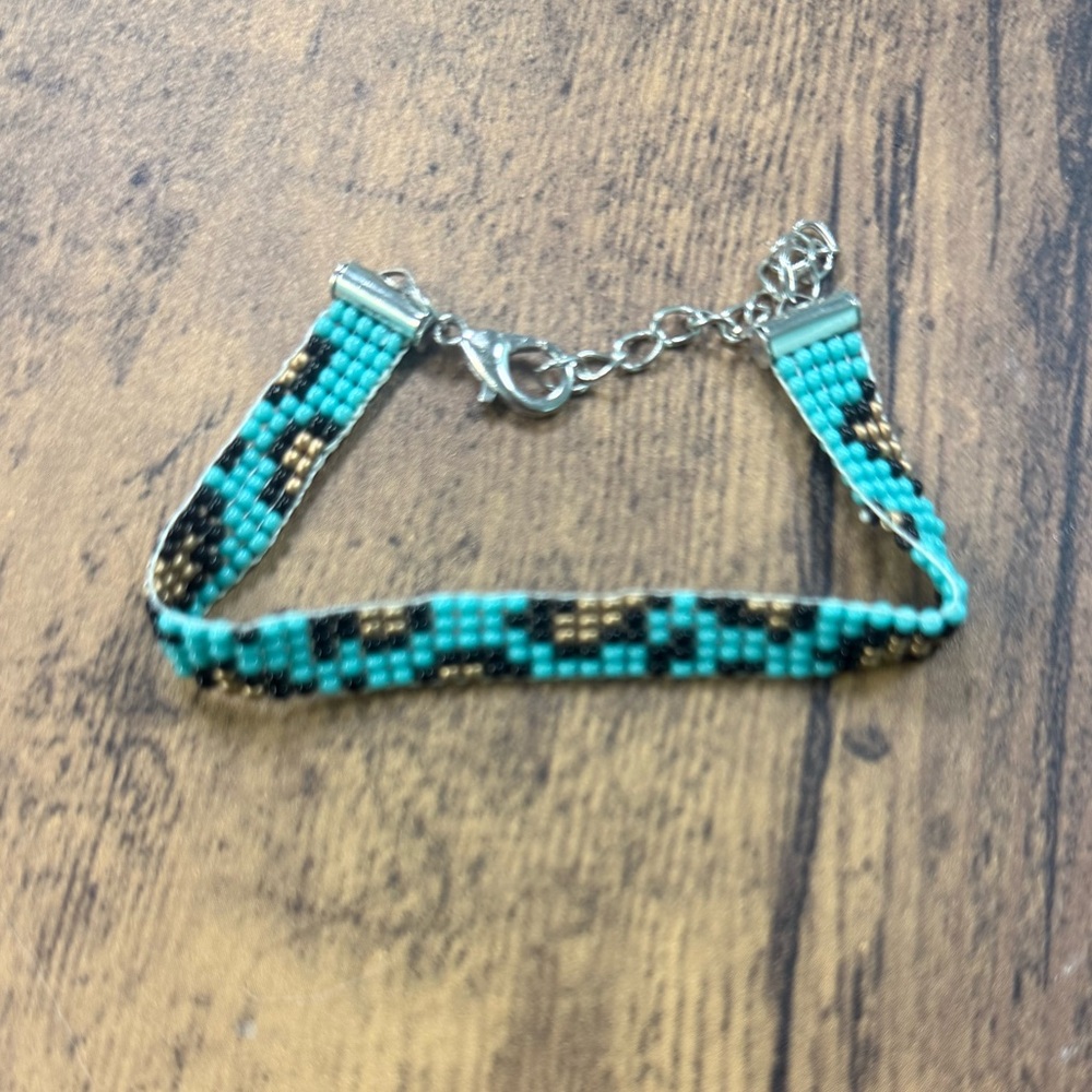 Teal leopard print hand woven bracelet with size extender